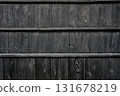 The grain and texture of the black wood walls seen in traditional Japanese architecture 131678219