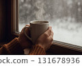 Woman's hands drinking a hot drink 131678936