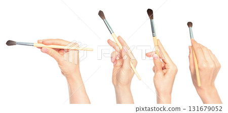 Set of human hands holding paintbrush isolated on transparent background 131679052