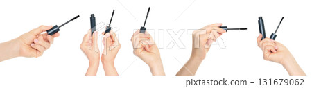 Set of human hands holding eyelash mascara and brush isolated on transparent background. Set of human hands holding eyelash mascara and brush isolated on transparent background. 131679062