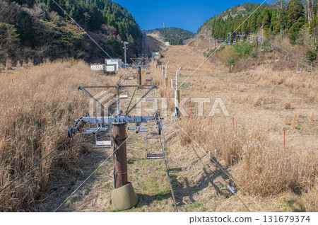 A closed ski resort covered in grass 131679374