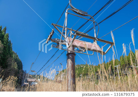 A closed ski resort covered in grass 131679375