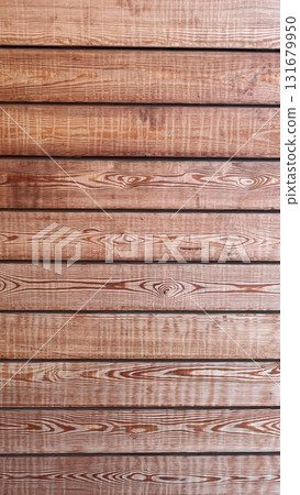 Beautiful wooden texture showcasing natural patterns and grains on a rustic wall surface 131679950