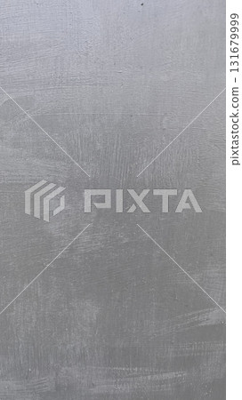 Freshly cut grass piled in sunlight at a garden in summer, showcasing vibrant green colors and texture 131679999