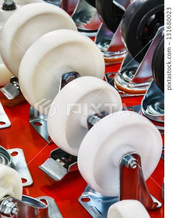 High-quality industrial wheels on metal brackets for various applications displayed on a red background 131680023
