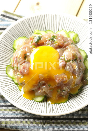 Crack the egg yolk on top of the Spanish mackerel yukke Crack the egg yolk on top of the Spanish mackerel yukke 131680039