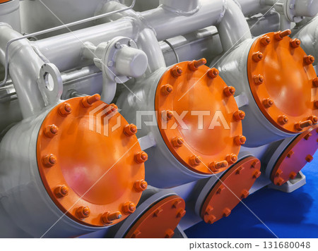 Colorful industrial valves on machinery at a manufacturing facility showcasing advanced engineering and technology 131680048