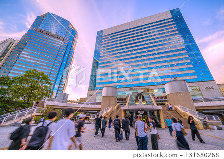 Tokyo cityscape in Japan, overlooking Shinagawa Station, office buildings, and businessmen after work 131680268