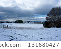 Snow-covered fields and rice paddies visible in the distance 131680427