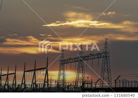 High voltage pole electric wiring distribution landscape energy engineering. Electricity energetic background with blue sky green mountain in countryside. Electric power energy engineering industrial 131680540