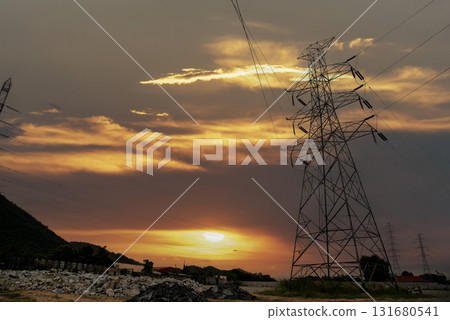 High voltage pole electric wiring distribution landscape energy engineering. Electricity energetic background with blue sky green mountain in countryside. Electric power energy engineering industrial 131680541