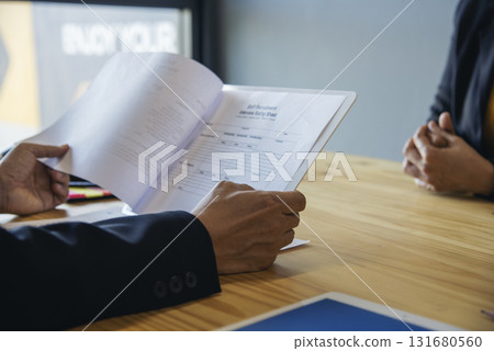 Job HR applicants having an interview with Human resource manager jobs interviewing with confident candidate at business firm office give cv resume. Job Interview with headhunter agent and applicant 131680560