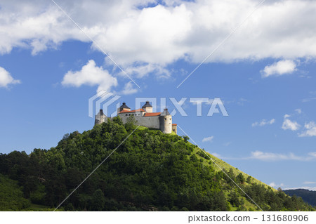 Krasna Horka castle standing on green hill in Slovakia 131680906