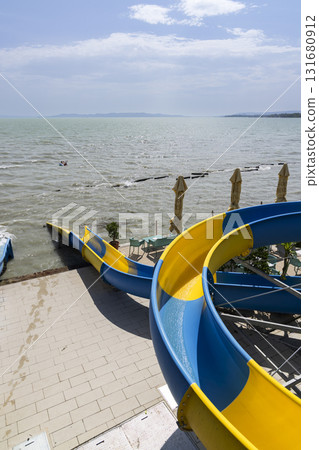 Colorful water slides ending in lake Balaton at Paloznak 131680912