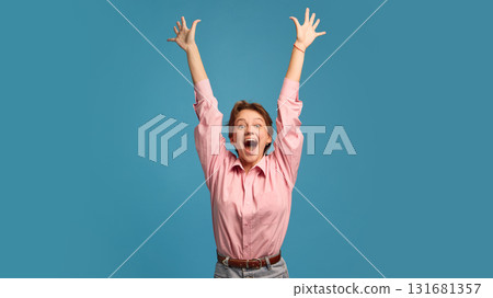 Happy woman with raised arms expressing triumph and excitement Happy woman with raised arms expressing triumph and excitement 131681357
