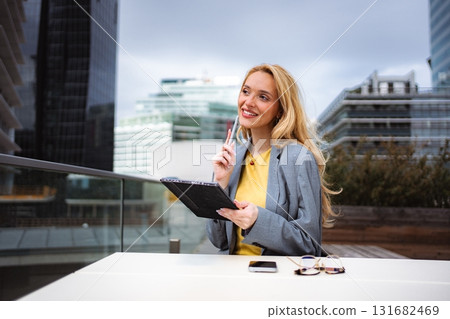 Businesswoman looking for inspiration, working with tablet outdoors 131682469
