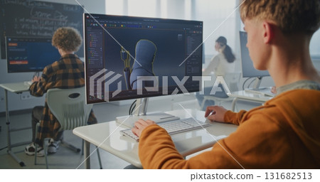 Focused Student in University Game Development Course Designs 3D Character for Video Game Focused Student in University Game Development Course Designs 3D Character for Video Game 131682513