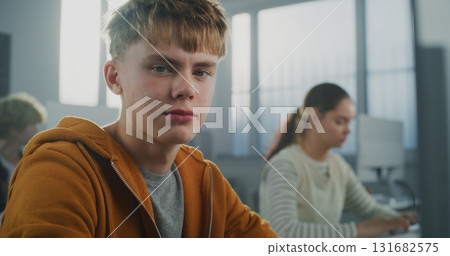 Handsome Student Works on Developing Game in Classroom Handsome Student Works on Developing Game in Classroom 131682575
