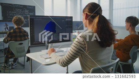 Young Woman Studies 3D Design at Computer in Classroom 131682593