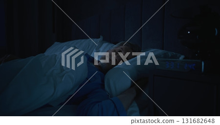 Tired From Insomnia, Man Tries Fall Asleep in Early Hours of Morning 131682648