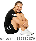 Relaxed Woman in Workout Clothes Resting After Exercise 131682879