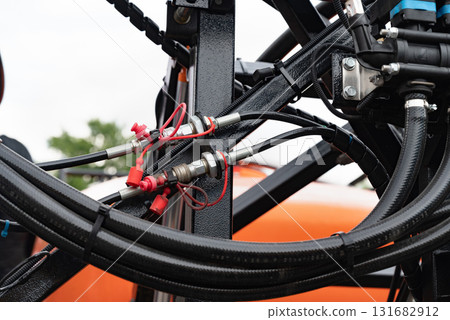 High pressure hydraulic hose system connected to steel pipes, close-up. Marine hydraulics. 131682912