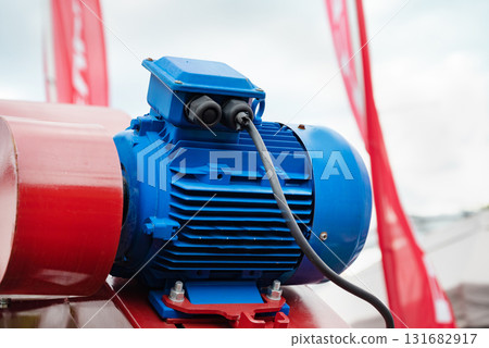 Industrial equipment. New blue electric motors with pumps on the stainless steel production line. Additive pump station in petrochemical technology. Industrial equipment. New blue electric motors with pumps on the stainless steel production line. Additive pump station in petrochemical technology. 131682917