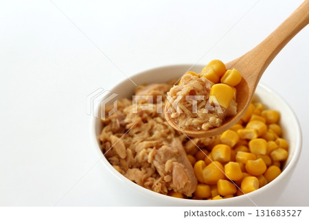 Tuna cone scooped with a wooden spoon on a white background Tuna cone scooped with a wooden spoon on a white background 131683527