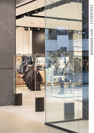 Radio-frequency security gates with integrated metal detector at a clothing store entrance 131683851