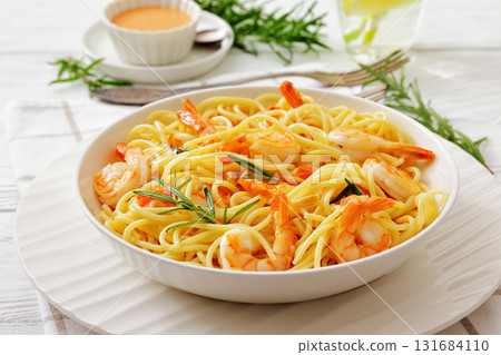 yummy spaghetti with shrimps in a white bowl 131684110