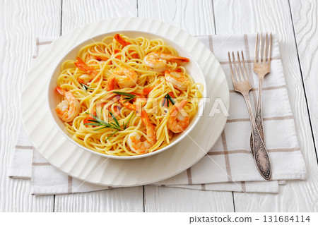 yummy spaghetti with shrimps in a white bowl 131684114