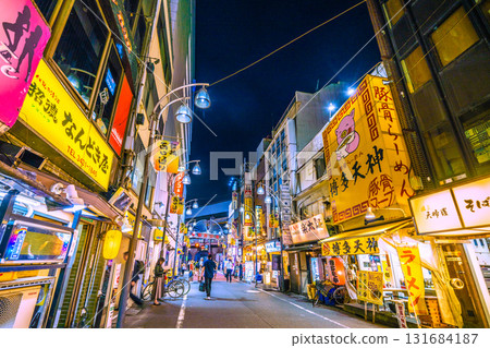 Tokyo cityscape, Japan, October 2nd. View of the bar district of Shinbashi West Exit Street and the Karasumori Exit of Shinbashi Station (in the background). 131684187