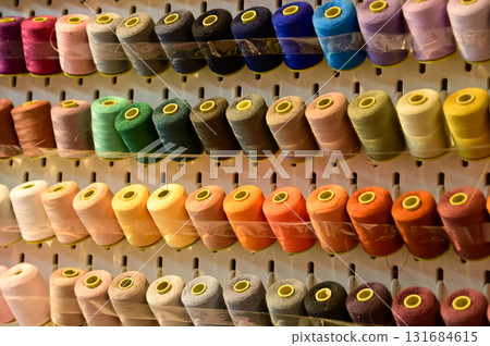 Close up view of a set of sewing threads. Multi-colored thread. For background use. Close up view of a set of sewing threads. Multi-colored thread. For background use. 131684615