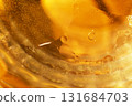 Gold Oil bubbles. circles of orange water macro. abstract yellow background 131684703