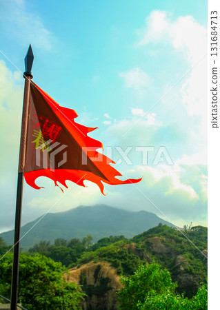 Close up of the traditional Chinese ancient style flag in the rural. Using it during the war, for identify which side. Translation: Spring and Autumn Period. 131684713