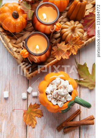 Cozy autumn arrangement with hot chocolate and candles 131684772