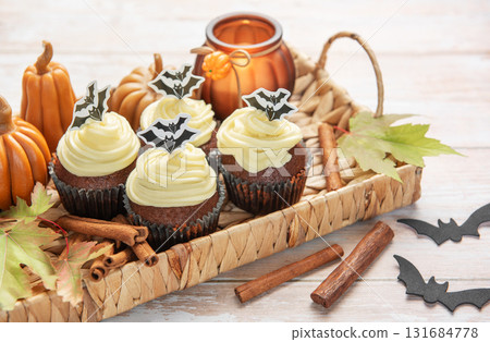 Halloween cupcakes with bat decoration and autumn elements 131684778