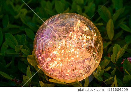 Lighting decoration in the garden at night. Glowing lamp. Copy space. Lighting decoration in the garden at night. Glowing lamp. Copy space. 131684909