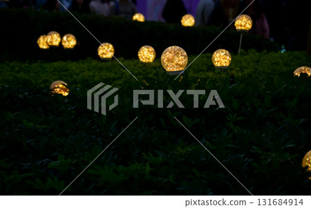 Lighting decoration in the garden at night. Glowing lamp. Copy space.  131684914