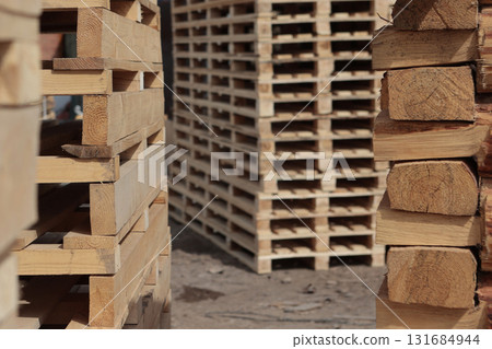 Wooden pallets. Wooden pallets for transportation of building materials.Pallets made of renewable wood. Wooden pallets. Wooden pallets for transportation of building materials.Pallets made of renewable wood. 131684944
