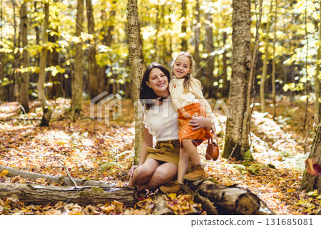 Mature mother with daughter on autumn forest. 131685081