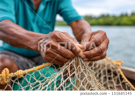 Fisherman repairing fishing net on a boat 131685145