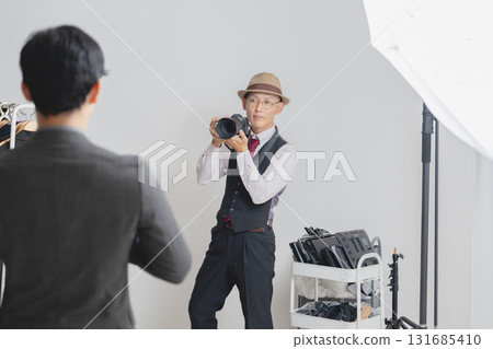 Cameraman taking pictures in the studio 131685410