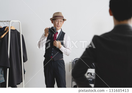 Cameraman taking pictures in the studio 131685413