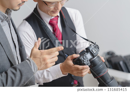 Cameraman taking pictures in the studio 131685415