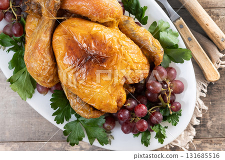 Roast turkey with grapes and parsley for thanksgiving dinner Roast turkey with grapes and parsley for thanksgiving dinner 131685516
