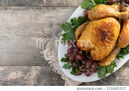 Roast turkey with grapes and parsley for thanksgiving dinner Roast turkey with grapes and parsley for thanksgiving dinner 131685517