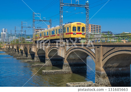Nishitetsu 600 series train passing over the Najima River Bridge Nishitetsu 600 series train passing over the Najima River Bridge 131685663