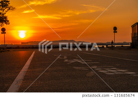"Sea Ahead" road sign and sunset 131685674