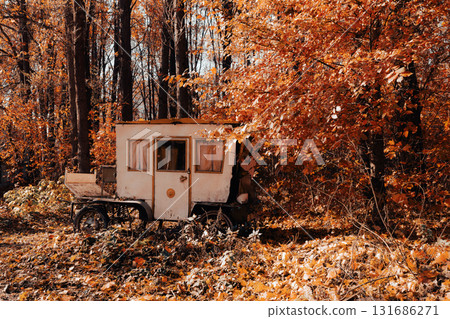 Abandoned Autumn Caravan Hidden in Golden Forest Abandoned Autumn Caravan Hidden in Golden Forest 131686271